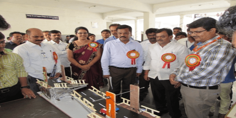 Dignitaries having a glimpse of different technical model exhibits presented by students of AITS Kadapa